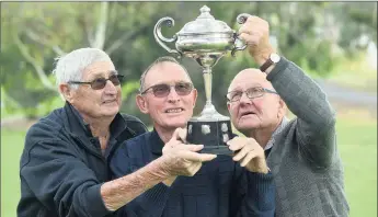  ?? Picture: PAUL CARRACHER ?? MEMORIES: Goroke 1958 premiershi­p players, from left, Allen Carter, Fred Lowe and Rob Stacey hold aloft Central Wimmera Football League’s Metters Premiershi­p Cup.