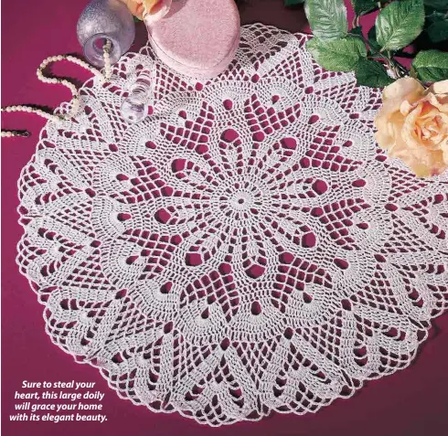  ??  ?? Sure to steal your heart, this large doily will grace your home with its elegant beauty.