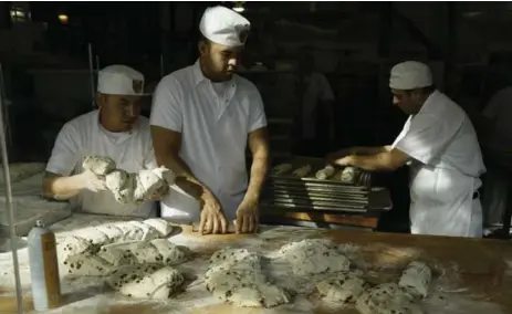  ?? ERIC RISBERG/THE ASSOCIATED PRESS FILE PHOTOS ?? Bakers make sourdough bread at the Boudin Bakery in San Francisco. Boudin Bakery uses mother dough that can be traced back to the Gold Rush.