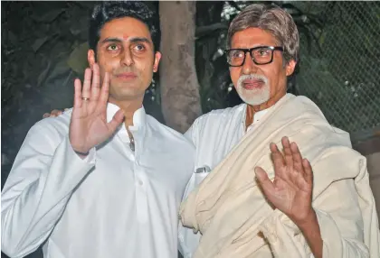  ??  ?? Bollywood megastar Amitabh Bachchan and son Abhishek Bachchan.