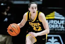  ?? Michael Conroy/associated Press ?? Iowa guard Caitlin Clark is expected to break the NCAA all-time scoring record held by Kelsey Plum of Washington, who had 3,527 career points.