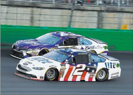  ?? Russell Labounty ?? The Associated Press Brad Keselowski (2) and Joey Gase race Saturday in the NASCAR Quaker State 400 at Kentucky Speedway in Sparta, Ky.