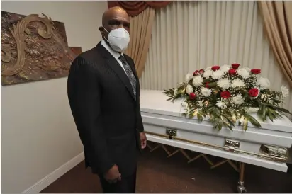  ?? WILFREDO LEE — THE ASSOCIATED PRESS ?? Andre Dawson at the Paradise Memorial Funeral Home, Thursday, in Miami. For baseball Hall of Famer Dawson, owning a funeral home has taken some getting used to. Now he’s adjusting to life as a mortician in Miami during a global pandemic. He wears a mask and gloves, and explains to customers that services in the chapel must be shorter than normal and limited to 10 people.