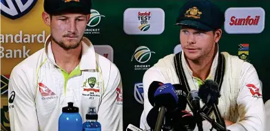  ??  ?? Shameful: Aussies Bancroft and Smith face the media after the ball-tampering scandal
