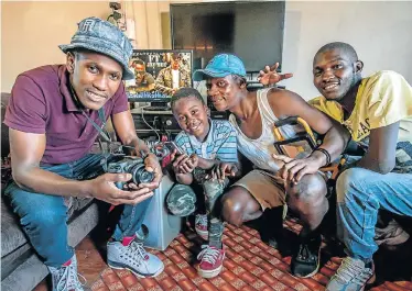  ?? Picture: MARK WEST ?? RISING STARS: Veeplaas heroes, from left, Simphiwe Stofile, Somangaye Msetu, Mandlenkos­i Speelman and Xolani Govani in their makeshift video studio