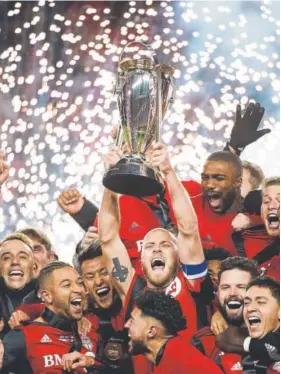  ?? The Canadian Press ?? Toronto FC players celebrate Saturday after beating the visiting Seattle Sounders 2-0 to win the MLS Cup. Toronto was the runner-up in 2016.