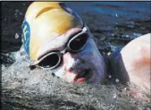  ??  ?? Sarah Thomas swims the last mile of her nearly 82-mile swim across Lake Powell. The marathon effort might break a record.