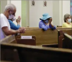  ?? (AP PHOTO/ERIC GAY, FILE) ?? Parishione­rs wear face masks as they attend an in-person Mass at Christ the King Catholic Church in San Antonio, Tuesday, May 19, 2020.