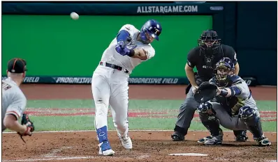  ?? AP/RON SCHWANE ?? Joey Gallo of the Texas Rangers hits a home run for the American League off National League pitcher Will Smith of the San Francisco Giants during the AL’s victory in Tuesday night’s All-Star Game at Progressiv­e Field in Cleveland.