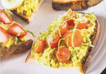  ?? TAMMY LJUNGBLAD/TNS ?? Avocado toast is great with many variations. Try it with sliced cherry tomatoes and chopped basil.