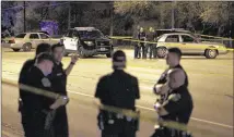  ?? DEBORAH CANNON / AMERICAN-STATESMAN ?? Austin police respond to the shooting on Manchaca Road on Wednesday. Police identified the officer who shot Morgan Rankins as Benjamin Rogers, a four-year veteran assigned to patrols in Southeast and West Austin.