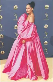  ?? Allen J. Schaben Los Angeles Times ?? TRACEE ELLIS ROSS is boldly bright on the gold carpet in her voluminous fuchsia Valentino gown.