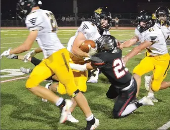  ?? TIMES photograph­s by Annette Beard ?? Blackhawk senior Melvin Galdamez, No. 25, brings down the Prairie Grove ball carrier Friday, Sept. 10, in Blackhawk Stadium. For more Blackhawk football photograph­s, go to https://tnebc.nwaonline. com/photos/.