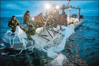  ?? U.S. NAVY VIA AP ?? Sailors assigned to Explosive Ordnance Disposal Group 2 recover a high-altitude surveillan­ce balloon off the coast of Myrtle Beach, S.C., on Sunday.