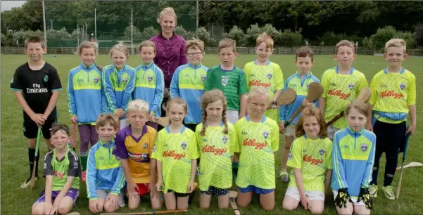  ??  ?? Coach Roisin Cooney and her kids at the Kellogg’s Cúl Camp at Glynn-Barntown GAA grounds.