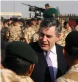  ?? ?? Boots on the ground: Gordon Brown meets troops serving in Afghanista­n