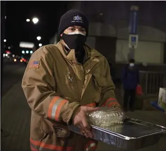  ?? PHOTO BY JUSTIN DURNER ?? A Crozer EMS team member gets ready to deliver aid to the homeless.