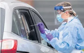  ??  ?? NHS staff carry out coronaviru­s tests at a testing facility in Lincoln