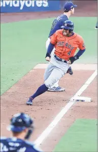  ?? Karen Warren / Houston Chronicle ?? The Astros’ George Springer sprints around third to score on a double hit by Jose Altuve during Game 6 of the ALCS on Oct. 16.