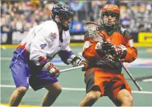  ?? ERNEST DOROSZUK/FILES ?? Shawn Evans, right, seen playing for the Calgary Roughnecks in 2014, may be the spark his new team, the Vancouver Warriors, needs to get its National Lacrosse League season on track.