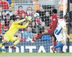  ??  ?? Safe hands: Liverpool keeper Alisson denies Pascal Gross