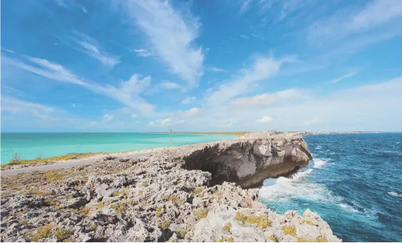  ?? COURTESY PHOTO ?? BAHAMIAN RHAPSODY: Eleuthera’s celebrated Glass Window Bridge is a popular attraction in the Bahamas. On one side visitors enjoy viewing the blue water of the Atlantic Ocean; on the other, the glorious turquoise of the Caribbean Sea.