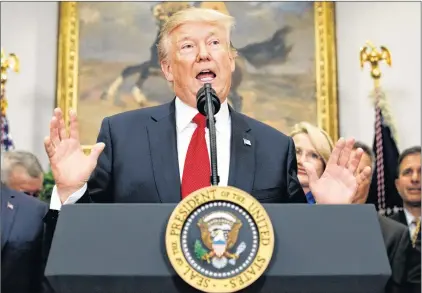  ?? EVAN VUCCI/THE ASSOCIATED PRESS ?? U.S. President Donald Trump speaks before signing an executive order on health care in the Roosevelt Room of the White House, Oct. 12, in Washington.