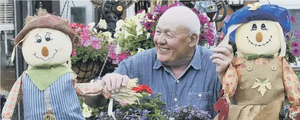  ??  ?? Last year’s Muston Scarecrow Festival has a big hit. Pictured is Philip Walker tending to his exhibit.