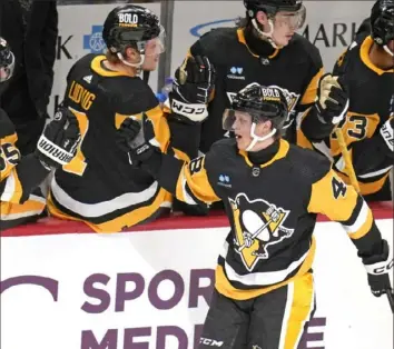  ?? Gene J. Puskar/Associated Press ?? Valtteri Puustinen celebrates his goal against Detroit last Sunday at PPG Paints Arena.