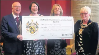  ??  ?? Pictured is a cheque being presented to the Loughborou­gh Wellbeing Café .