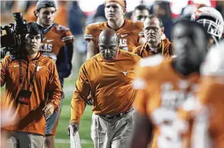  ?? Tom Reel / San Antonio Express-News ?? Charlie Strong exits the field at Darrell K Royal Stadium after Friday’s 22-point loss to TCU gave him a 16-21 record at Texas, a .432 percentage that ranks last in the annals of UT head coaches.