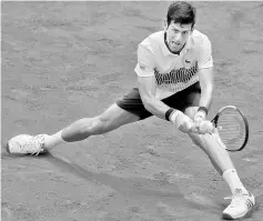  ??  ?? Serbia’s Novak Djokovic in action during his first round match against Spain’s Marcel Granollers. — Reuters photo