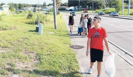  ?? JUAN CARLOS CHAVEZ/TAMPA BAY TIMES ?? Jack Tooley, 15, is autistic. His mother, Maria “Lalita” Tooley, says walking outdoors has improved her son’s personalit­y and attitude.