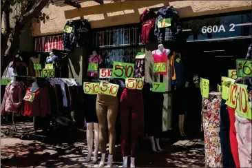  ?? ADRIANA HELDIZ — CALMATTERS ?? A clothing store in the San Ysidro neighborho­od of San Diego on April 16.