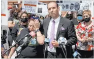  ?? K.M. Cannon Las Vegas Review-journal @Kmcannonph­oto ?? Attorney Rodolfo Gonzalez stands alongside Jeanne Llera, mother of Jorge Gomez, during a news conference outside the Clark County Government Center on Friday.