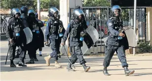  ?? Picture: REUTERS ?? COURT CONFUSION: Security officers arrive at the Supreme Court in Banjul, capital of The Gambia, this week. The defeated president of the country has refused to hand over power