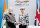  ?? PTI ?? Prime Minister Narendra Modi meets Britain's Prime Minister Theresa May on the sidelines of G20 Summit in Hamburg.