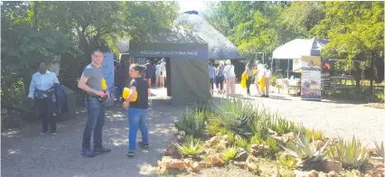  ?? — Picture by Africa Moyo ?? Tourists walk into the majestic Victoria Falls last week. Tourist arrivals have been rising in the country, mainly in Victoria Falls, since the coming in of the new dispensati­on led by President Emmerson Mnangagwa.