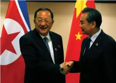  ?? Reuters ?? Chinese foreign minister Wang Yi, right, with his North Korean equal Ri Yong-ho at the Asean Regional Forum yesterday