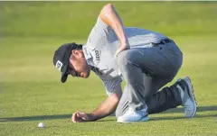  ?? AFP ?? Louis Oosthuizen looks at his ball on the 17th fairway in the third round.