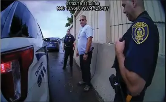  ?? LAWRENCE PD ?? Screengrab­s of body-camera footage showing a Lt. Joseph Caloiaro, middle, in plain clothes following along the shoulder of Route 295.