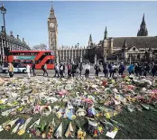  ?? AP ?? Floral tributes to the victims of the Westminste­r attack are placed outside the Palace of Westminste­r, London, yesterday.