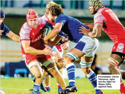 ?? ?? Formidable: Christ Tshiunza, right, led the fight for Wales U20s against Italy