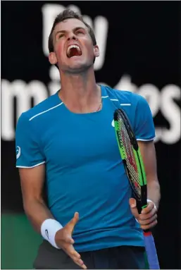  ?? The Associated Press ?? Canada’s Vasek Pospisil reacts while playing Croatia’s Marin Cilic during their first round match at the Australian Open in Melbourne, Monday.