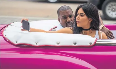  ?? DESMOND BOYLAN/THE ASSOCIATED PRESS FILE PHOTO ?? When Kanye red-flags picture-taking within a temporal context, he’s taking a subconscio­us shot at Kim, Vinay Menon writes.