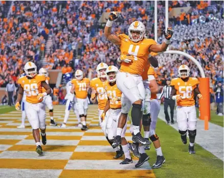  ?? PHOTO BY PATRICK MURPHY-RACEY ?? Tennessee’s Dominick Wood-Anderson (4) celebrates after catching a touchdown pass from Jarrett Guarantano in the second half Saturday at Neyland Stadium. The Vols beat 12th-ranked Kentucky 24-7.