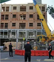  ?? STUART CAHILL / HERALD STAFF ?? TRAGIC FALL: Police found a man deceased at a constructi­on site near Maverick Station in an apparent accident on Wednesday.