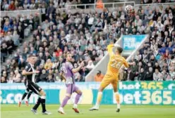  ?? Reuters ?? Tottenham Hotspur’s Harry Kane (centre) scores a goal against Newcastle during their English Premier League match on Sunday.