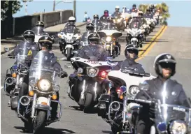  ?? PATRICK TEHAN/STAFF ?? Procession for motorcycle Officer Michael Katherman proceeds down W. San Carlos Street.