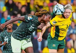  ?? TERTIUS PICKARD/AP PHOTO ?? Australia’s Alanna Kennedy, right, goes for a header with Nigeria’s Christy Ucheibe during the Women’s World Cup match on Thursday in Brisbane, Australia.